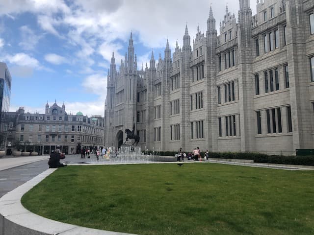 Marischal College's granite frontage and fountains on Broad Street, Aberdeen
